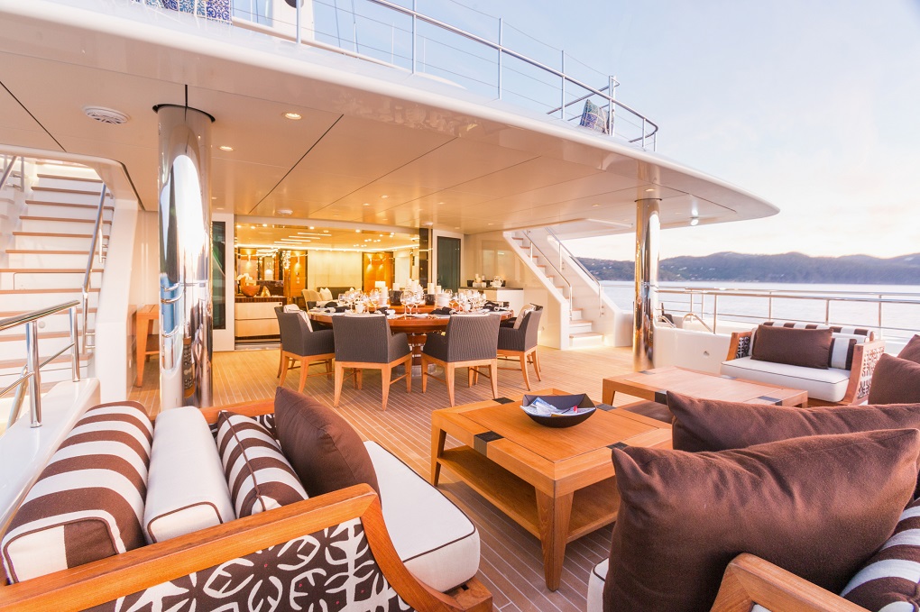 Outdoor living and dining area with sea view of Party Girls yacht Yachtzoo