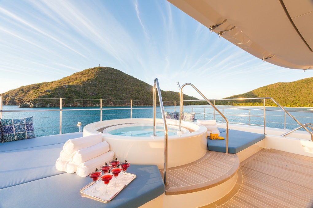 Outdoor jacuzzi and sunbed area Party Girl yacht Yachtzoo