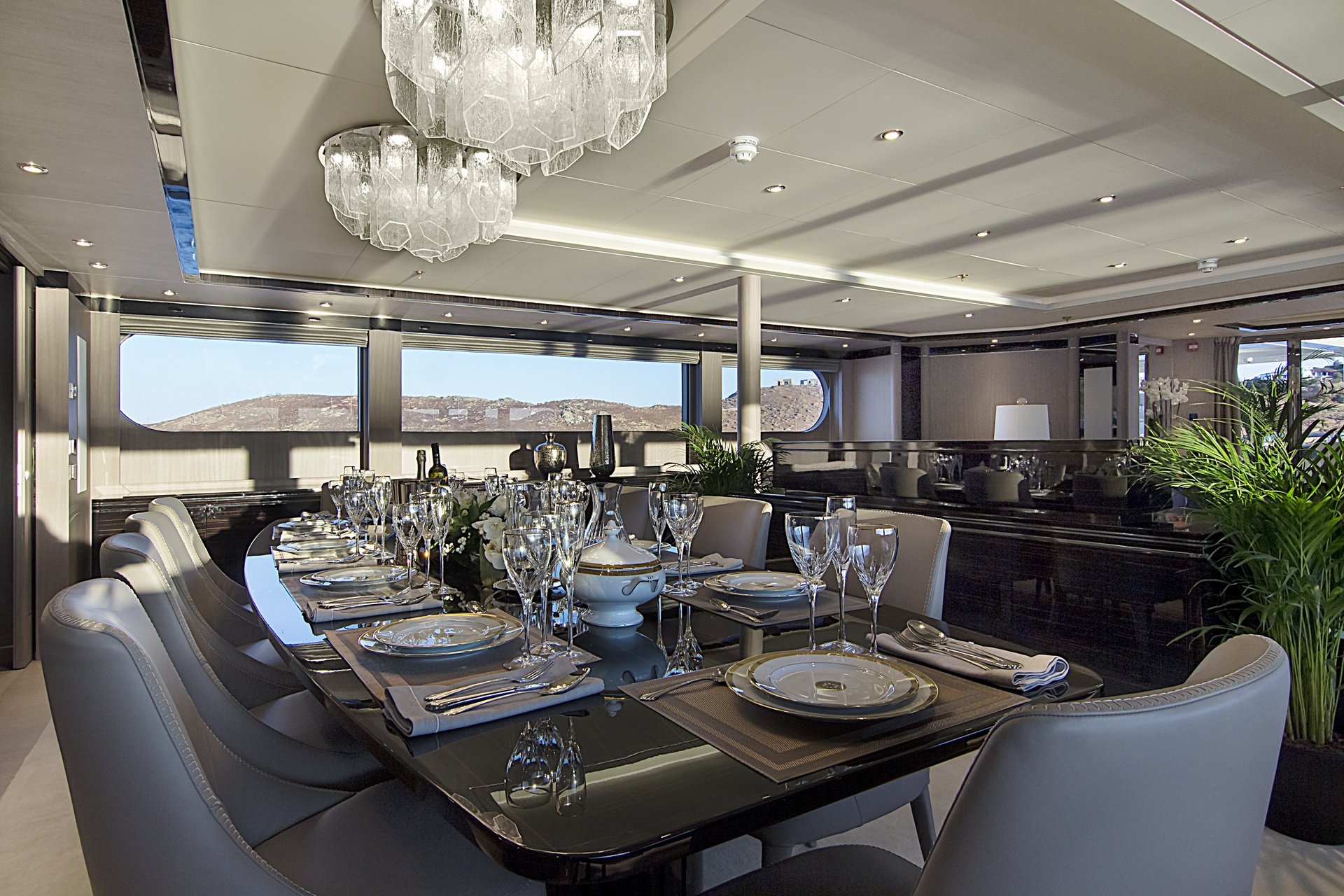 m/y invader yacht for charter indoor dining area